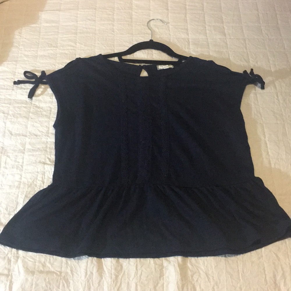 A kids blue shirt.